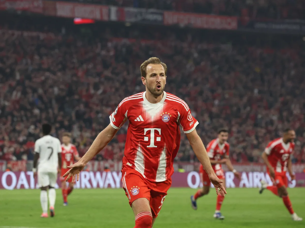 Bayern Munich's English forward #09 Harry Kane celebrates after scoring the equalizing 2-2 goal during the UEFA Champions League quarter-final second leg football match between FC Bayern Munich and Real Madrid in Munich, southern Germany, on April 15, 2026. (Photo by Karl-Josef HILDENBRAND / AFP)