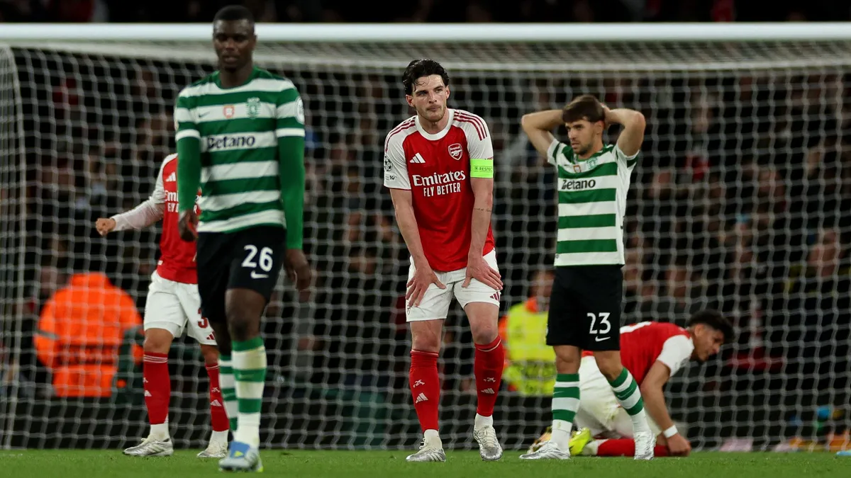 Arsenal's English midfielder #41 Declan Rice reacts after the UEFA Champions League quarter-final, second-leg football match between Arsenal and Sporting Lisbon at the Emirates Stadium in north London on April 15, 2026. (Photo by Adrian Dennis / AFP)