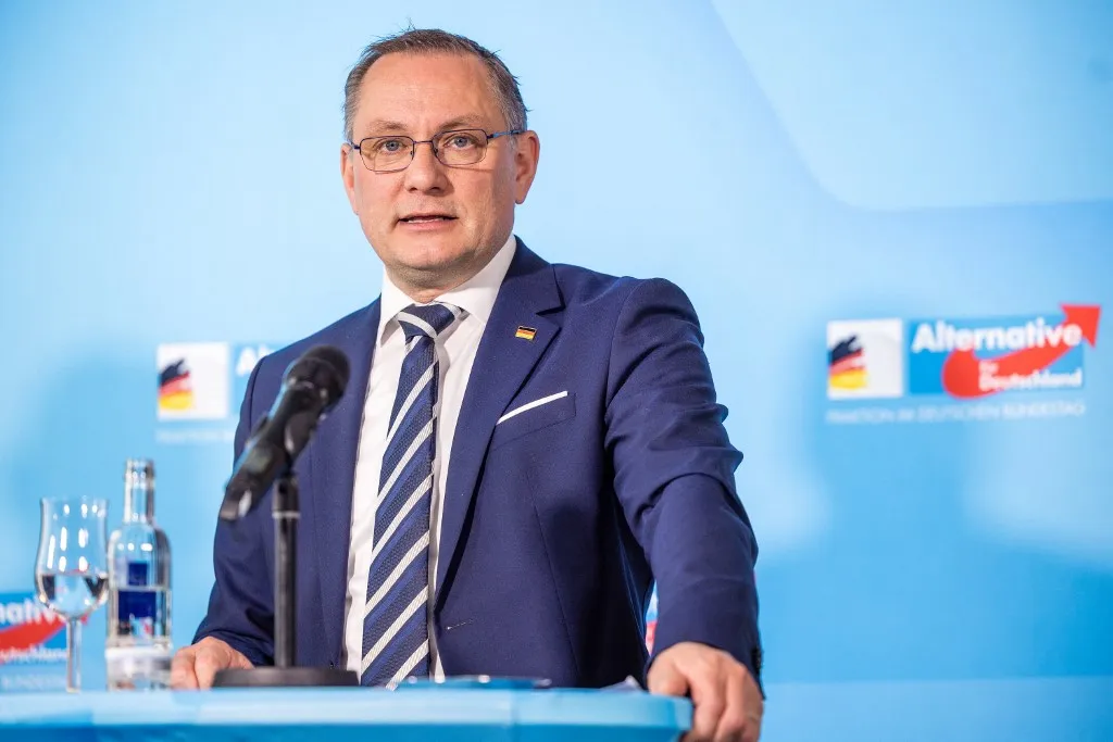 12 April 2026, Brandenburg, Cottbus: Tino Chrupalla (AfD), federal and parliamentary group leader, speaks at a press conference at the end of the AfD parliamentary group retreat in Cottbus. Photo: Frank Hammerschmidt/dpa (Photo by Frank Hammerschmidt / dpa Picture-Alliance via AFP)