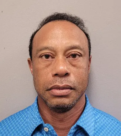 STUART, FLORIDA - MARCH 27:( EDITORS NOTE: This Handout image was provided by a third-party organization and may not adhere to Getty Images editorial policy.) In this handout photo provided by the Martin County Sheriff's Office, Tiger Woods poses for his booking photo after his arrest on March 27, 2026 in Stuart, Florida. According to reports, Woods was arrested after a rollover crash and will face a charge of driving under the influence. The Martin County Sheriff's Office said that Woods and the other driver involved in the two-car crash in Jupiter Island, Florida, were not injured. Martin County Sheriff's Office via Getty Images/AFP (Photo by Handout / GETTY IMAGES NORTH AMERICA / Getty Images via AFP)