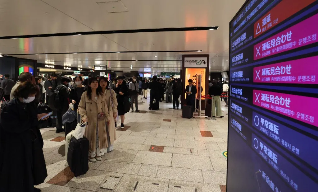 A photo shows the monitor indicating Shinkansen service is suspended and crowded Sendai station in Sendai City, Miyagi Prefecture, after the earthquake that struck off the coast of Iwate Prefecture, Japan, on April 20, 2026. Around 4:53 pm on that day, an earthquake with its epicenter off the coast of Sanriku occurred. According to the Japan Meteorological Agency, the epicenter was estimated to be about 10 km deep, and the earthquake's magnitude was 7.5 on the Richter scale. The quake registered a seismic intensity of 5+ in Sanpachikamikita, Aomori Prefecture, and 5- in the northern coast, Iwate Prefecture. Tsunami warnings have been issued for the Pacific coast of Hokkaido and Iwate Prefecture. ( The Yomiuri Shimbun ) (Photo by Yusuke Matsumoto / The Yomiuri Shimbun via AFP)