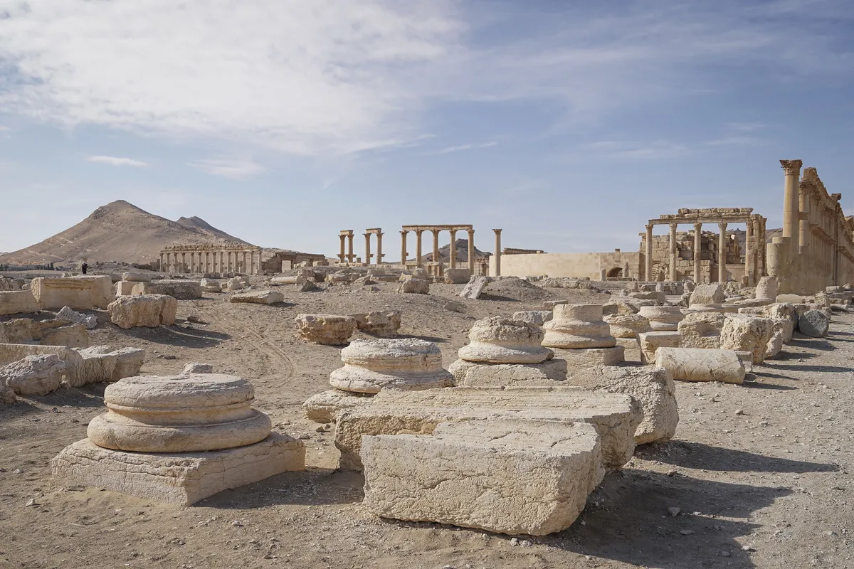 HOMS, SYRIA - DECEMBER 30: A view of the ancient city of Palmyra (Tadmor), which is on UNESCOâ€™s World Heritage List, in Homs, Syria on December 30, 2025. The ruins of Palmyra, which was inscribed on the World Heritage List by UNESCO in 1980, were damaged by the Daesh in 2015. The former Bashar al-Assad regime also brought this cultural heritage to the brink of destruction through artillery and air strikes in an attempt to retake control of the ancient city. After the fall of the regime and the formation of a new government in Syria, local tourists are now visiting the heavily devastated Palmyra for the first time in 14 years, hoping for the day when it will be restored to its former glory. Adri Salido / Anadolu (Photo by Adri Salido / Anadolu via AFP)