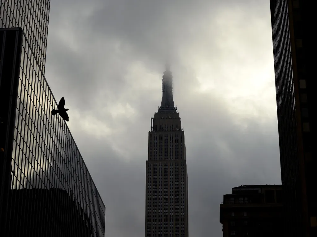 Empire State Building, EmpireStateBuilding, 

The Empire State Buiding is surrounded in the morning fog as the sun comes in New York October 23, 2017. (Photo by TIMOTHY A. CLARY / AFP)