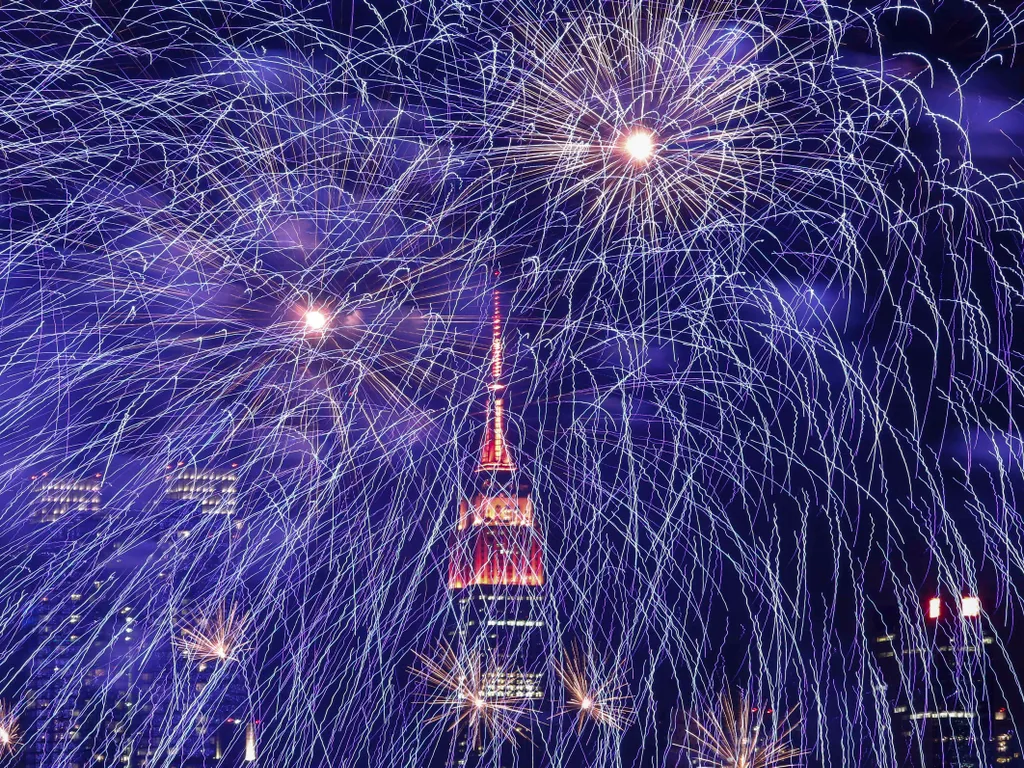 Empire State Building, EmpireStateBuilding, 

Fireworks burst over the New York skyline, the Empire State Building lit in red and gold  in honor of the Chinese Lunar New Year, as seen from Weehawken, New Jersey, on February 6, 2016. (Photo by KENA BETANCU