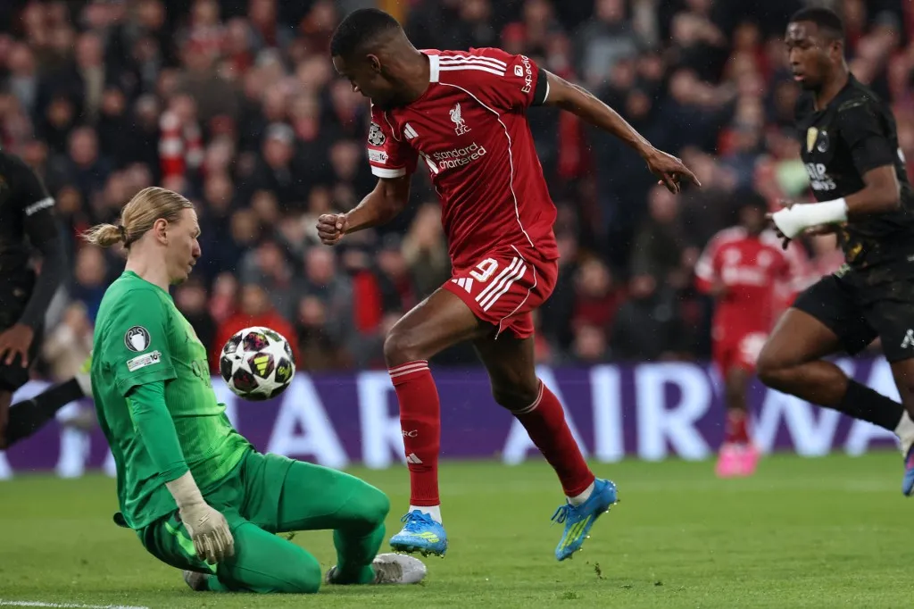 Liverpool's Swedish striker #09 Alexander Isak (C) tries to go around Paris Saint-Germain's Russian goalkeeper #39 Matvey Safonov
 (L) during the UEFA Champions League quarter final, second-leg football match between Liverpool and Paris Saint-Germain at Anfield in Liverpool, north west England on April 14, 2026. (Photo by FRANCK FIFE / AFP)