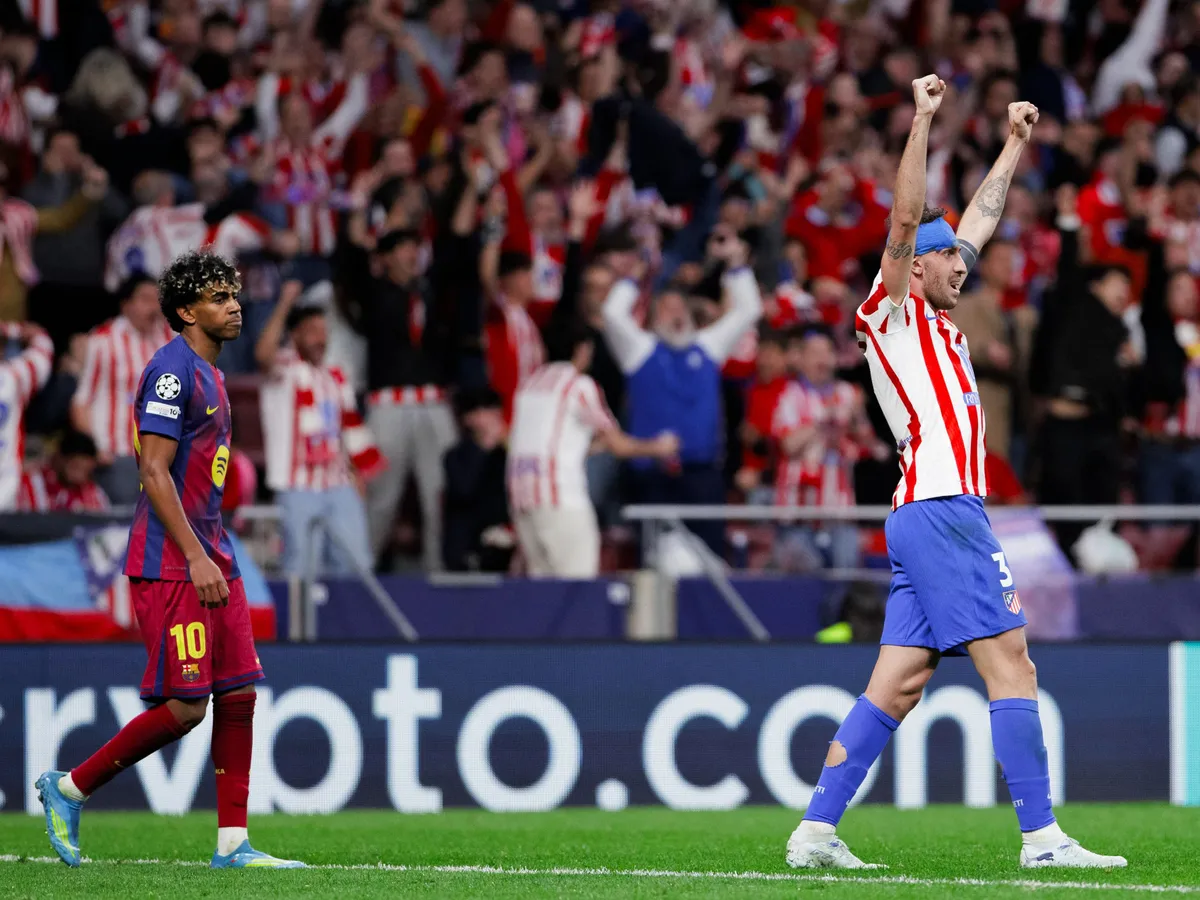 Matteo Ruggeri of Atletico de Madrid celebrates victory and Lamine Yamal of FC Barcelona reacts to defeat during the UEFA Champions League 2025/26 Quarter-Final second leg match between Atletico de Madrid and FC Barcelona at Riyadh Air Metropolitano Stadium in Madrid, Spain, on April 14. (Photo by Guillermo Martinez/NurPhoto) (Photo by Guillermo Martinez / NurPhoto via AFP)