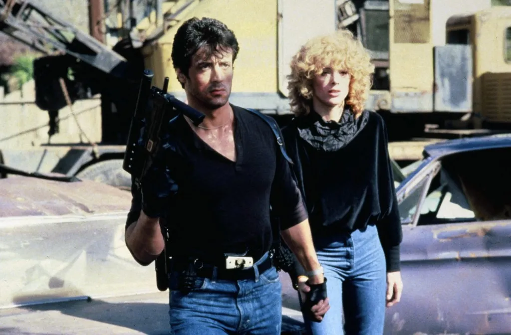 Cobra
1986
real George P. Cosmatos
Sylvester Stallone
Brigitte Nielsen.
COLLECTION CHRISTOPHEL © Warner Bros. / Cannon (Photo by Warner Bros. / Cannon / Collection ChristopheL via AFP)
