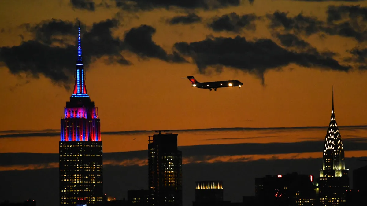 Empire State Building, EmpireStateBuilding, The Empire State Building is lit in colors of the FC Barcelona football club as seen from the USTA Billie Jean King National Tennis Center in New York on September 7, 2016, in honor of FC Barcelona's 10-year global partnership with UNICEF. (Photo by EDUARDO MUNOZ ALVAREZ / AFP)