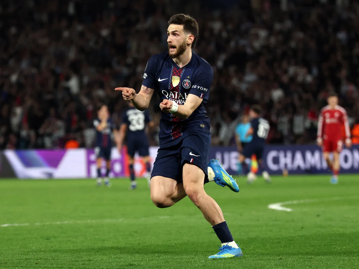 Paris Saint-Germain's Georgian forward #07 Khvicha Kvaratskhelia celebrates scoring his team's second goal during the UEFA Champions League quarter-final first leg football match between Paris Saint-Germain (PSG) and Liverpool FC at the Parc des Princes stadium in Paris on April 8, 2026. (Photo by Anne-Christine POUJOULAT / AFP)