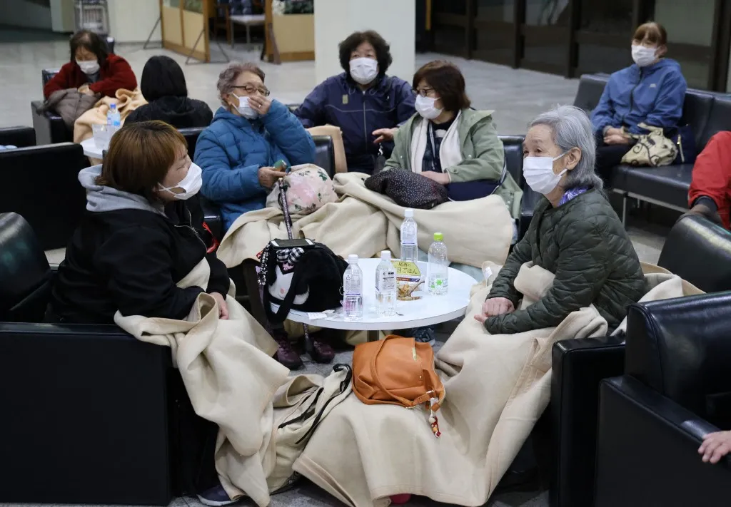 Local people evacuate to community center after a tsunami warning is issued due to massive earthquake in Hidaka Town, Hokkaido Prefecture on April 20, 2026. Around 4:53 pm on the same day, the earthquake with its epicenter off the coast of Sanriku, the Pacific coast of the northern part of the Japanese archipelago, occurred. According to the Japan Meteorological Agency, the epicenter was estimated to be about 19 km deep, and the earthquake's magnitude was 7.7 on the Richter scale. The quake registered a seismic intensity of 5+ in Sanpachikamikita, Aomori Prefecture, and 5- in the northern coast, Iwate Prefecture. Tsunami warnings have been issued for the Pacific coast of Hokkaido and Iwate Prefecture. ( The Yomiuri Shimbun ) (Photo by Ryoichiro Kida / The Yomiuri Shimbun via AFP)