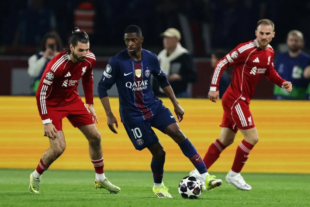 Dominik Szoboszlai of Liverpool FC (left), Ousmane Dembele of Paris Saint-Germain (center), and Alexis Mac Allister of Liverpool FC (right) during the UEFA Champions League quarter-final first leg match between Paris Saint-Germain and Liverpool FC at the Parc des Princes stadium in Paris, France. (Photo by Ibrahim Ezzat/NurPhoto) (Photo by Ibrahim Ezzat / NurPhoto via AFP)