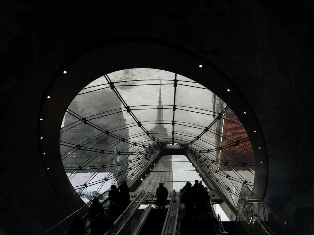 Empire State Building, EmpireStateBuilding, 

The Empire State Building is seen through the large window as people use the entrance near 33rd Street and 7th Avenue to enter Penn Station in the Manhattan borough of New York City on February 19, 2026. (Phot