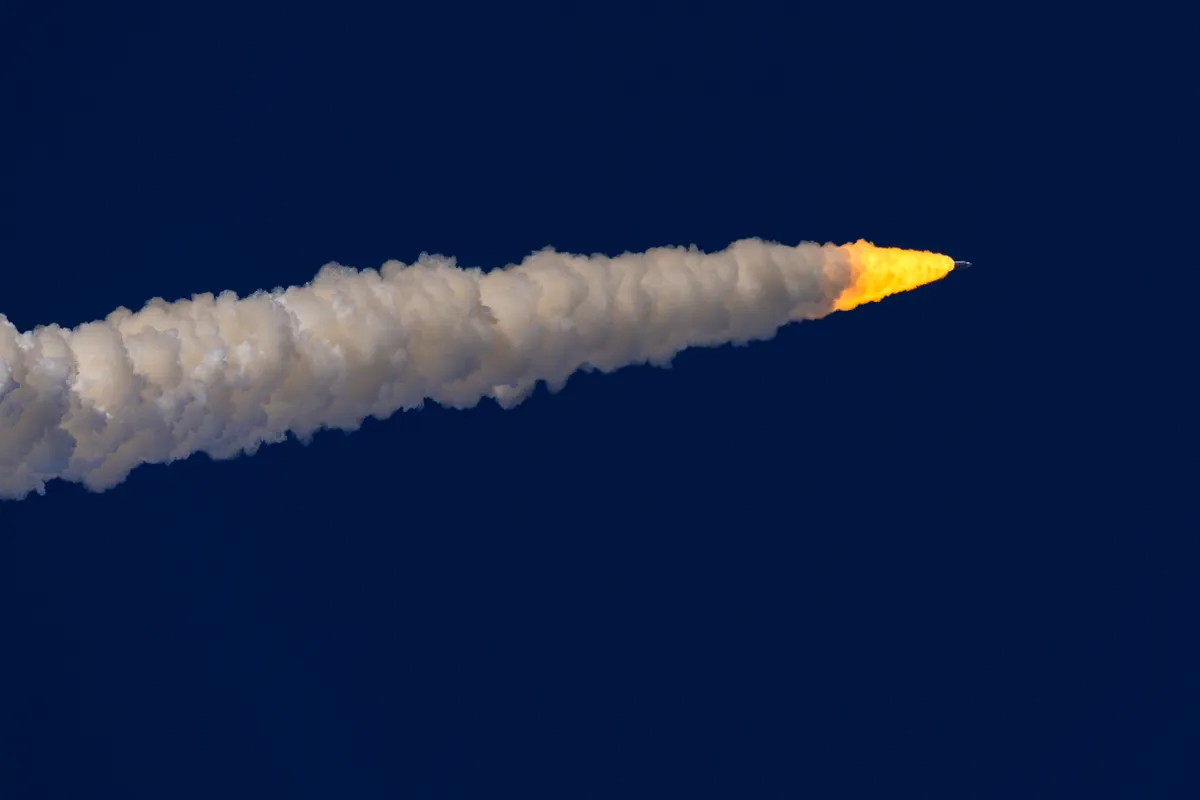 NASA's Artemis II Space Launch System rocket carrying the Orion spacecraft lifts off from Launch Complex 39B at Kennedy Space Center in Cape Canaveral, Florida, on April 1, 2026. The 10-day mission will take NASA astronauts Commander Reid Wiseman, Pilot Victor Glover, and Mission Specialist Christina Koch, along with Canadian Space Agency Mission Specialist Jeremy Hansen, around the moon and back. The astronauts are expected to travel 230,000 miles into space, the farthest any human has ever traveled from Earth. (Photo by Mauricio Paiz/NurPhoto) (Photo by Mauricio Paiz / NurPhoto via AFP)