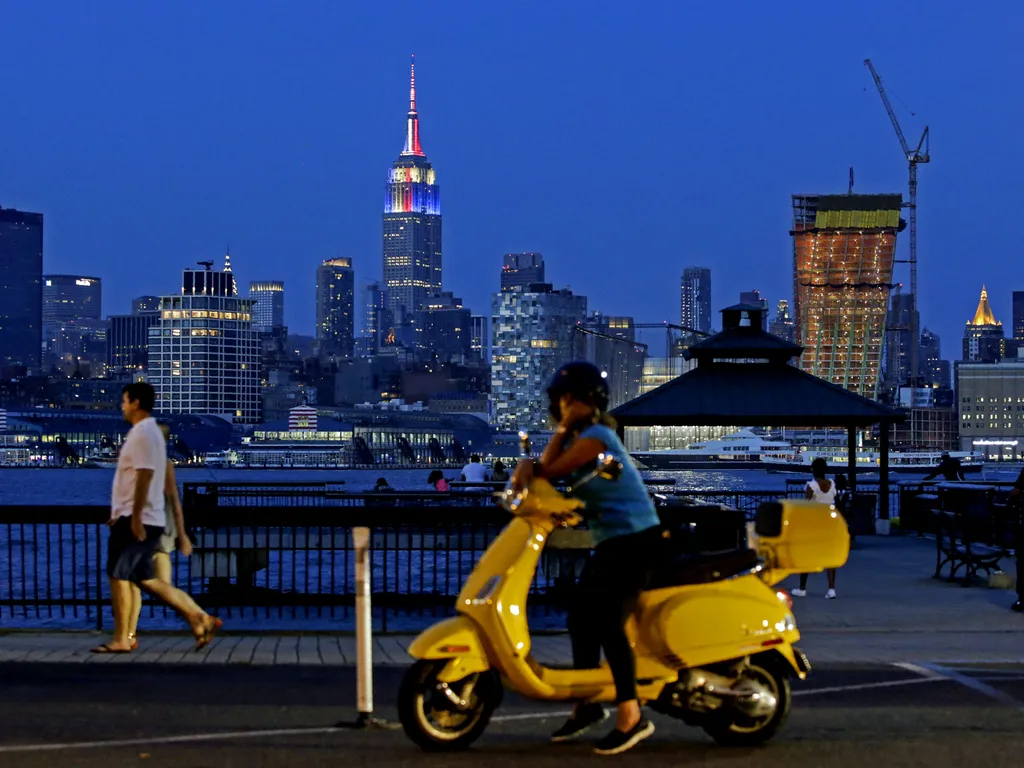 Empire State Building, EmpireStateBuilding, 

The Empire State Building is lit in honor of the 2018 World Cup Finalists, France and Croatias as people watch the skyline of New York from Hoboken in New Jersey on July 14, 2018. (Photo by EDUARDO MUNOZ ALVAR