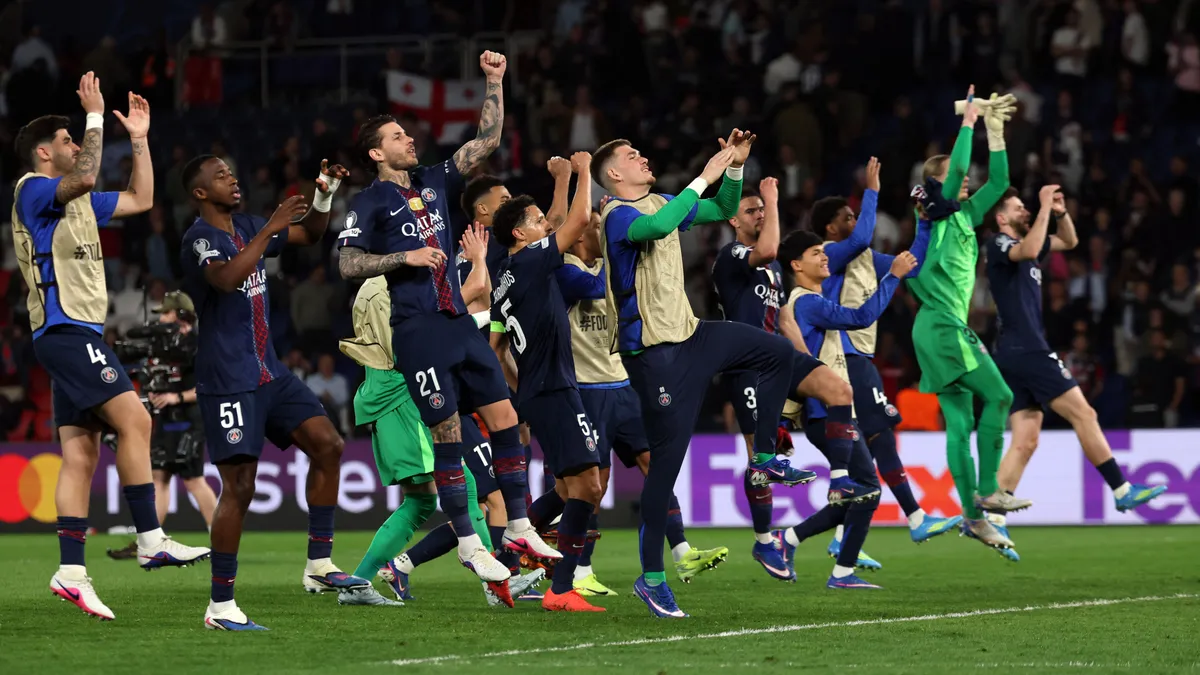 Paris' players celebrate their victory at the end of the UEFA Champions League quarter-final first leg football match between Paris Saint-Germain (PSG) and Liverpool FC at the Parc des Princes stadium in Paris on April 8, 2026. (Photo by Anne-Christine POUJOULAT / AFP)