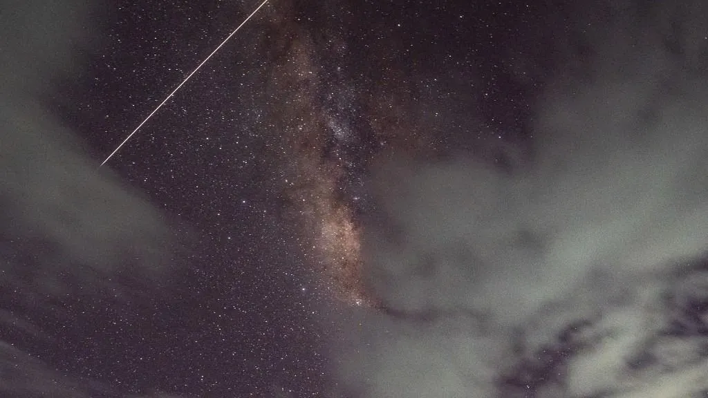The International Space Station (ISS) is moving in front of the Milky Way in Ratnapura, Sri Lanka, on April 16, 2024. In April 2024, skywatchers are anticipating a trio of celestial delights. The Lyrid meteor shower, known for its bright shooting stars, is peaking around April 22nd, providing a captivating show after midnight. On April 23rd, Venus and Mars are aligning closely in the night sky, offering a stunning conjunction. Additionally, the New Moon on April 1st is providing optimal conditions for stargazing, with minimal moonlight enhancing views of distant celestial wonders. Keep your eyes on the sky for these stellar events in April. (Photo by Thilina Kaluthotage/NurPhoto) (Photo by Thilina Kaluthotage / NurPhoto via AFP)