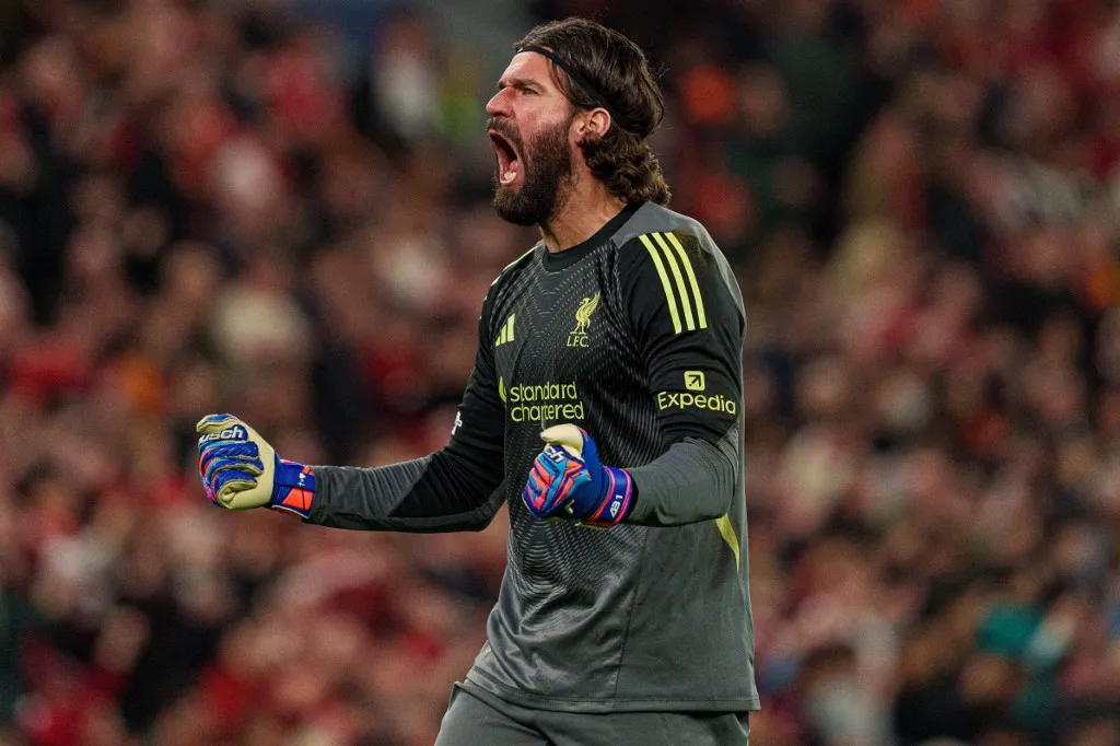 Liverpool's Alisson Becker celebrates during the UEFA Champions League Round of 16, 2nd Leg match between Liverpool and Galatasaray S.K. at Anfield, Liverpool, on March 19, 2026. (Photo by Steven Halliwell/MI News/NurPhoto) (Photo by MI News / NurPhoto via AFP)