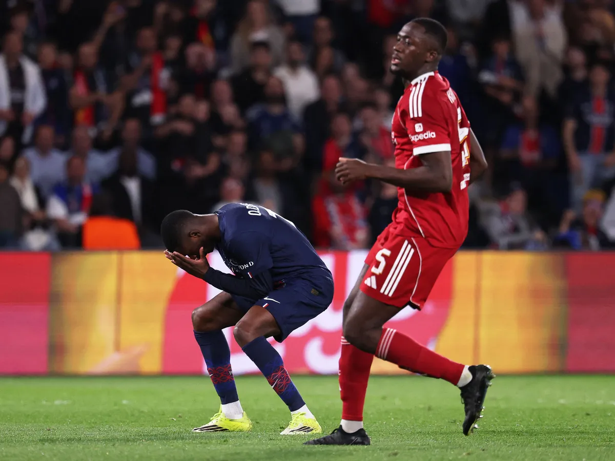 Paris Saint-Germain's French forward #10 Ousmane Dembele (L) reacts after missing a goal opportunity flanked by Liverpool's French defender #05 Ibrahima Konate  during the UEFA Champions League quarter-final first leg football match between Paris Saint-Germain (PSG) and Liverpool FC at the Parc des Princes stadium in Paris on April 8, 2026. (Photo by FRANCK FIFE / AFP)