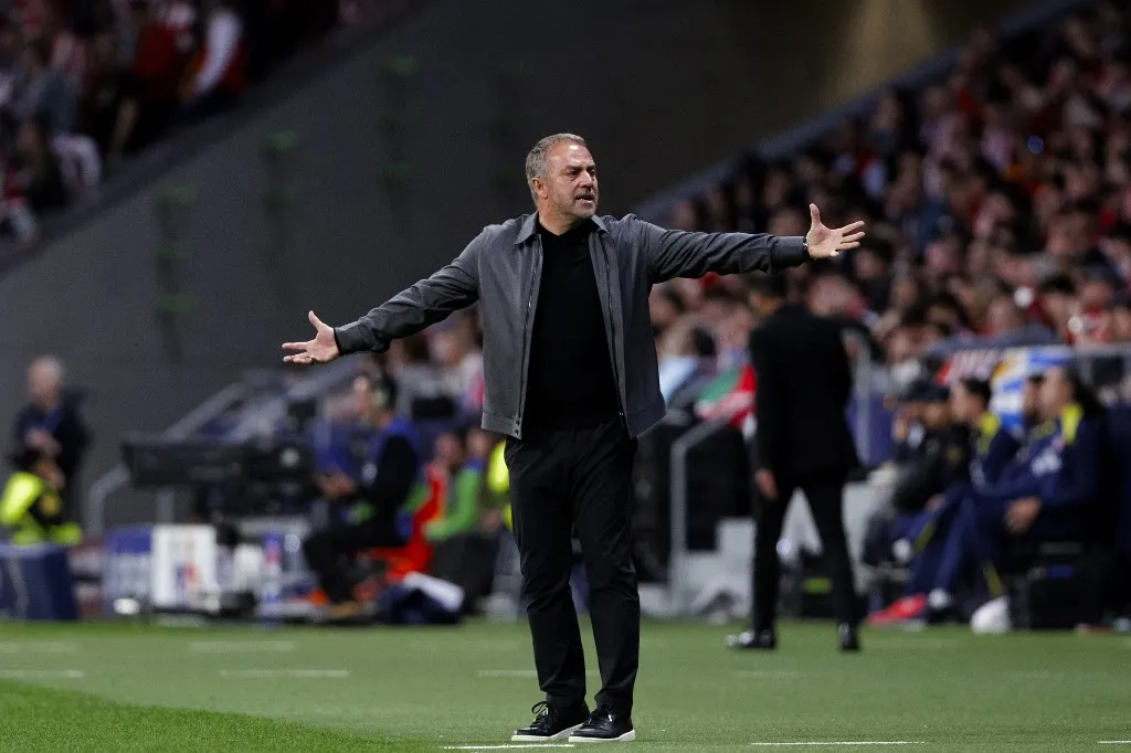 Head coach of Barcelona, Hansi Flick, speaks to the referee during the UEFA Champions League 2025/26 Quarter-Final second leg match between Atletico de Madrid and FC Barcelona at Riyadh Air Metropolitano Stadium in Madrid, Spain, on April 14. (Photo by Guillermo Martinez/NurPhoto) (Photo by Guillermo Martinez / NurPhoto via AFP)