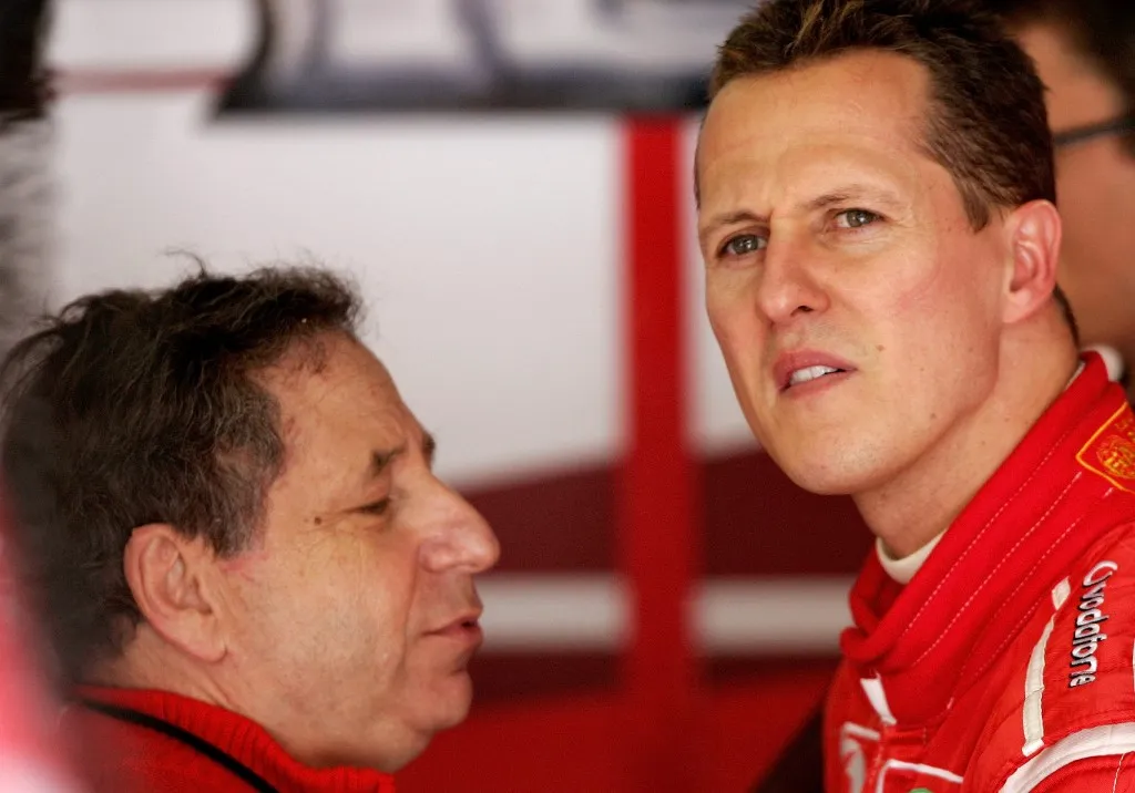 German Formula One pilot Michael Schumacher of Scuderia Ferrari F1 (R) and the teamchief of Scuderia Ferrari F1 team French Jean Todt stand in his pit during the third training session for the 2006 FORMULA 1 Grand Prix of Europe at the Nuerburgring circuit, Germany, Saturday 06 May 2006. Michael Schumacher clocked the best time. Photo: Roland Weihrauch (Photo by ROLAND WEIHRAUCH / dpa Picture-Alliance via AFP)