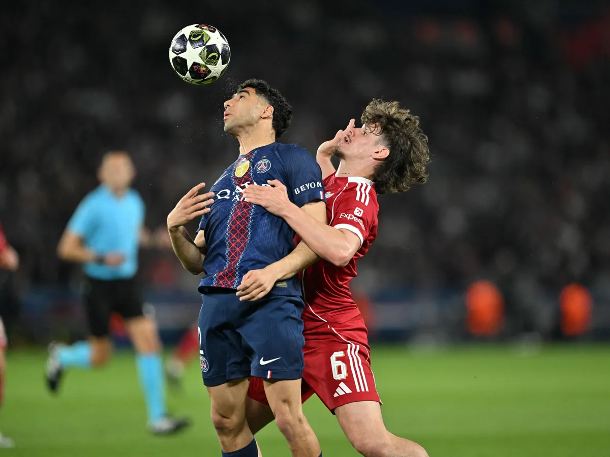 PARIS, FRANCE - APRIL 8: Achraf Hakimi of PSG in action against Milos Kerkez (6) of Liverpool during the UEFA Champions League 2025/26 Quarter-Final First Leg match between Paris Saint-Germain and Liverpool FC at Parc des Princes in Paris, France, on April 8, 2026. Mustafa Yalcin / Anadolu (Photo by MUSTAFA YALCIN / Anadolu via AFP)