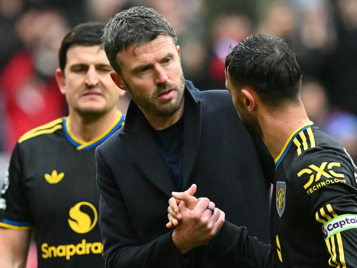 Manchester United's English Interim head coach Michael Carrick congratulates Manchester United's Portuguese midfielder #08 Bruno Fernandes after the English Premier League football match between Sunderland and Manchester United at The Stadium of Light in Sunderland in north east England on May 9, 2026. (Photo by ANDY BUCHANAN / AFP) / RESTRICTED TO EDITORIAL USE. No use with unauthorized audio, video, data, fixture lists, club/league logos or 'live' services. Online in-match use limited to 120 images. An additional 40 images may be used in extra time. No video emulation. Social media in-match use limited to 120 images. An additional 40 images may be used in extra time. No use in betting publications, games or single club/league/player publications. /