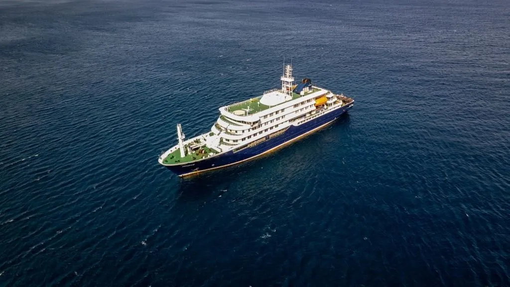 This aerial picture shows a general view of the cruise ship MV Hondius stationary off the port of Praia, the capital of Cape Verde, on May 3, 2026. An outbreak of "severe acute respiratory illness" on board a cruise ship in the Atlantic has left two people dead and a third in intensive care in Johannesburg, South Africa's health ministry told AFP on May 3, 2026.
The outbreak occurred on the MV Hondius, travelling from Ushuaia in Argentina to Cape Verde. The patient being treated in Johannesburg tested positive for a hantavirus, a family of viruses that can cause hemorrhagic fever, South African spokesperson Foster Mohale said. (Photo by AFP)