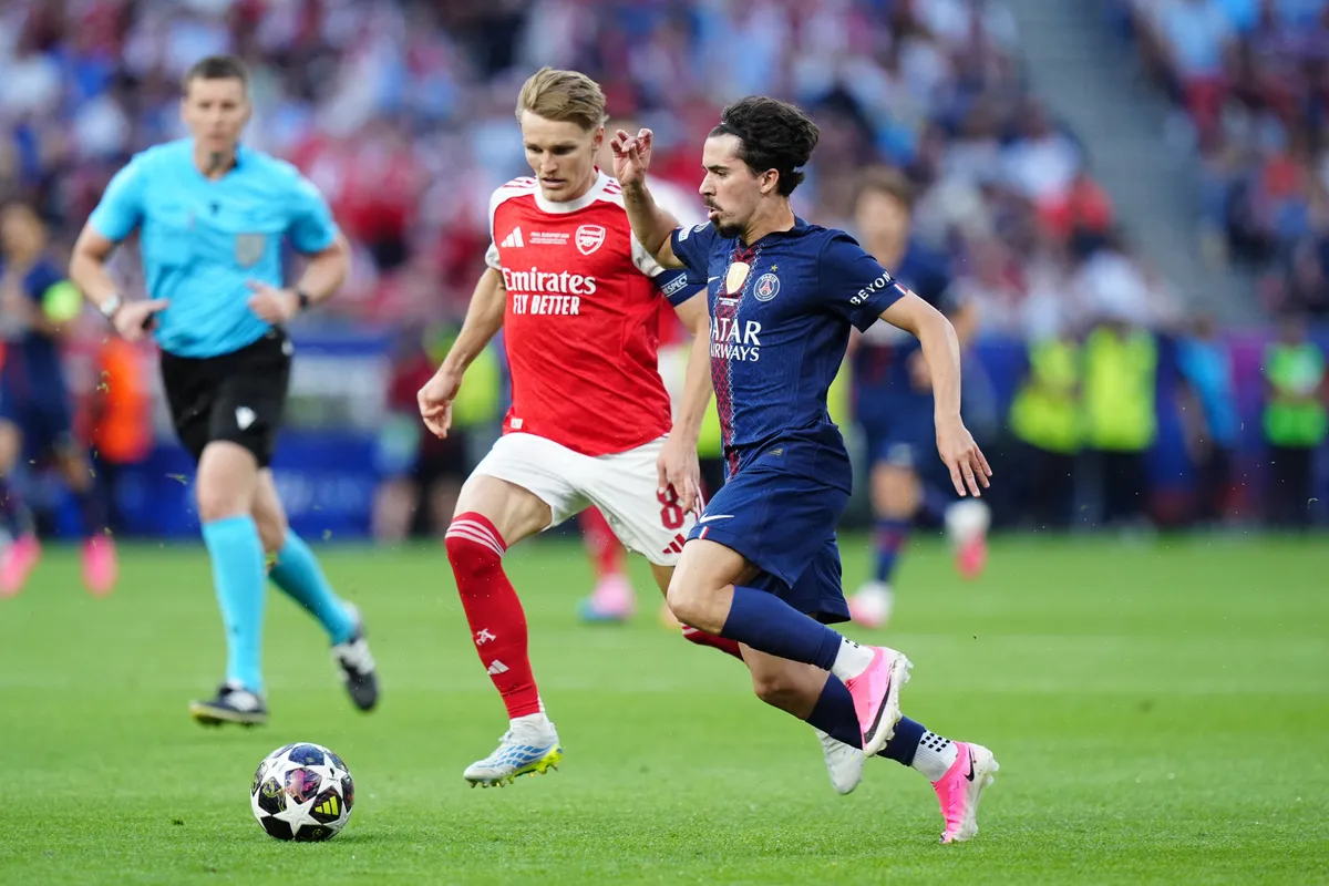 Martin Odegaard of Arsenal FC competes for the ball with Vitinha of Paris Saint-Germain FC during the UEFA Champions League Final match between Paris Saint-Germain FC and Arsenal FC at Puskas Arena on May 30, 2026 in Budapest, Hungary (Photo by Giuseppe Maffia/NurPhoto) (Photo by Giuseppe Maffia / NurPhoto via AFP)