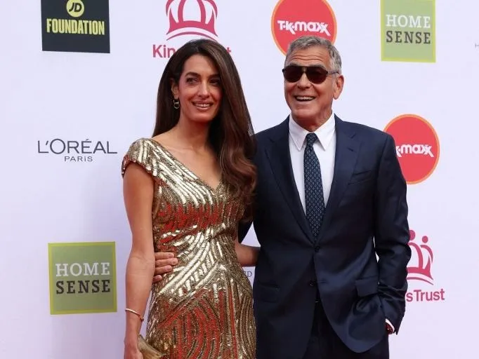 US actor George Clooney and his wife Amal Clooney arrive to attend A King's Trust celebration at the Royal Albert Hall in London on May 11, 2026, to celebrate the 50th anniversary of The Kings Trust. (Photo by Adrian Dennis / AFP)