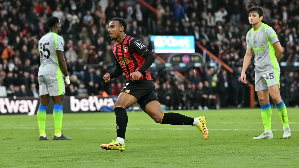 Bournemouth's French striker #22 Eli Junior Kroupi celebrates scoring the team's first goal during the English Premier League football match between Bournemouth and Manchester City at the Vitality Stadium in Bournemouth, southern England on May 19, 2026. (Photo by Glyn KIRK / AFP) / RESTRICTED TO EDITORIAL USE. No use with unauthorized audio, video, data, fixture lists, club/league logos or 'live' services. Online in-match use limited to 120 images. An additional 40 images may be used in extra time. No video emulation. Social media in-match use limited to 120 images. An additional 40 images may be used in extra time. No use in betting publications, games or single club/league/player publications. / 