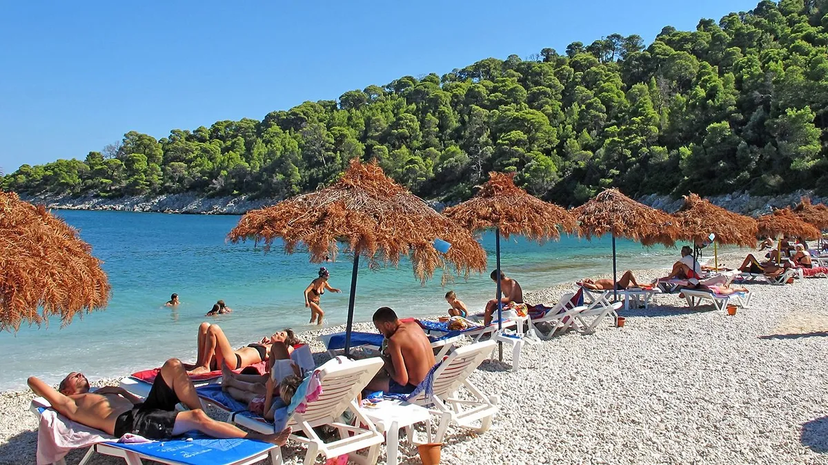 Greece, Alonissos, 22 Aug, 2010: Tourists at the Millia Beach, one of the most beautiful beach on the Greek island of Alonissos. nyaralás