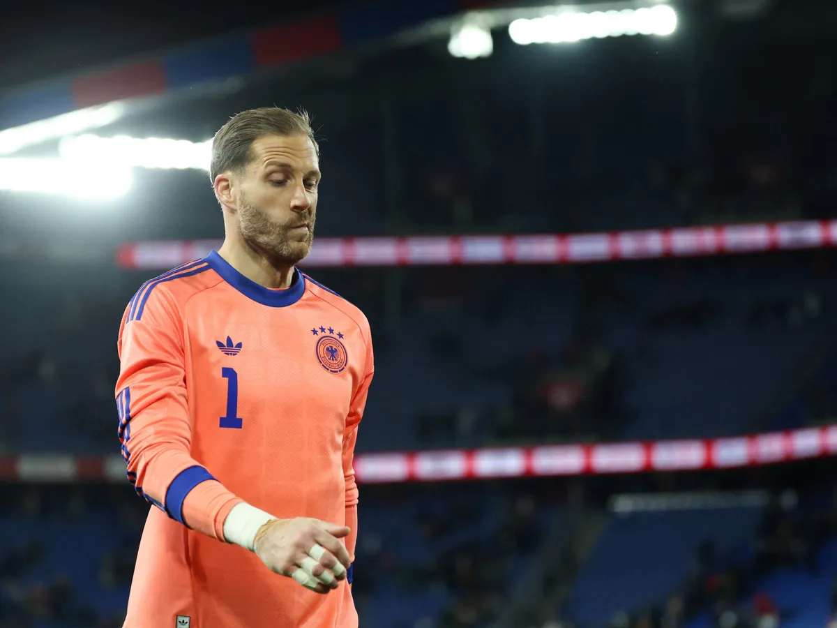 27 March 2026, Switzerland, Basel: Soccer, men, international matches, Switzerland - Germany, St. Jakob-Park, goalkeeper Oliver Baumann (Germany) leaves the pitch after the match. Photo: Christian Charisius/dpa - IMPORTANT NOTE: In accordance with the regulations of the DFL German Football League and the DFB German Football Association, it is prohibited to utilize or have utilized photographs taken in the stadium and/or of the match in the form of sequential images and/or video-like photo series. (Photo by CHRISTIAN CHARISIUS / dpa Picture-Alliance via AFP)