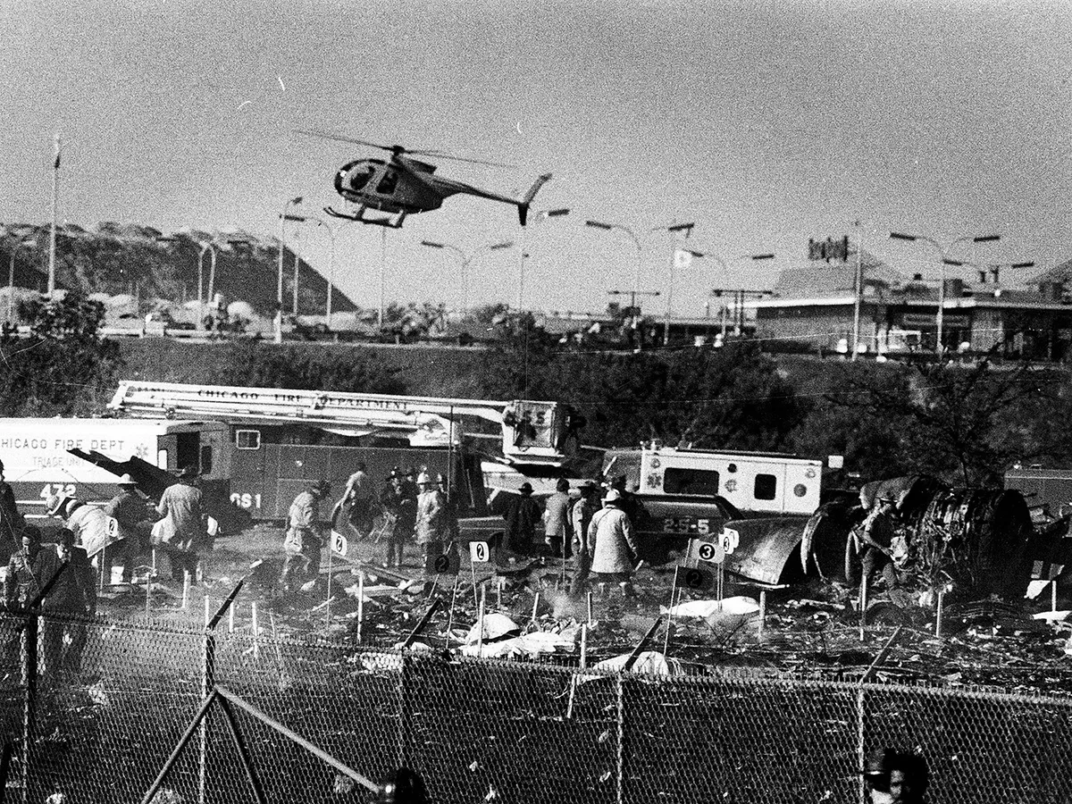 Victims are marked with numbered flags for identification as emergency workers sift through debris from American Airlines Flight 191, which crashed after take off from O'Hare International Airport on May 25, 1979. (Bob Fila/Chicago Tribune/Tribune News Service via Getty Images)