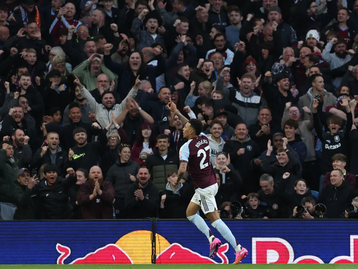 Aston Villa's English midfielder #27 Morgan Rogers celebrates scoring the opening goal of the English Premier League football match between Aston Villa and Liverpool at Villa Park in Birmingham, central England on May 15, 2026. (Photo by Darren Staples / AFP) / RESTRICTED TO EDITORIAL USE. No use with unauthorized audio, video, data, fixture lists, club/league logos or 'live' services. Online in-match use limited to 120 images. An additional 40 images may be used in extra time. No video emulation. Social media in-match use limited to 120 images. An additional 40 images may be used in extra time. No use in betting publications, games or single club/league/player publications. / 