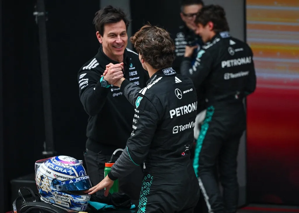 SHANGHAI, CHINA - MARCH 15:
Toto Wolff, Team Principal and CEO of Mercedes-AMG Petronas Formula One Team, congratulates George Russell after he finished second in the 2026 Chinese Grand Prix, at the Shanghai International Circuit, in Shanghai, China, on March 15, 2026. (Photo by Artur Widak/NurPhoto) (Photo by Artur Widak / NurPhoto via AFP)