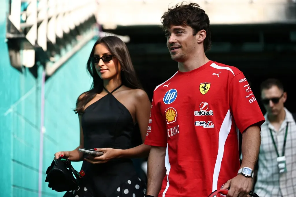 MIAMI, FLORIDA - MAY 02: Charles Leclerc of Monaco and Scuderia Ferrari and Alexandra Leclerc arrive in the Paddock prior to the Sprint ahead of the F1 Grand Prix of Miami at Miami International Autodrome on May 02, 2026 in Miami, Florida.   Chris Graythen/Getty Images/AFP (Photo by Chris Graythen / GETTY IMAGES NORTH AMERICA / Getty Images via AFP)