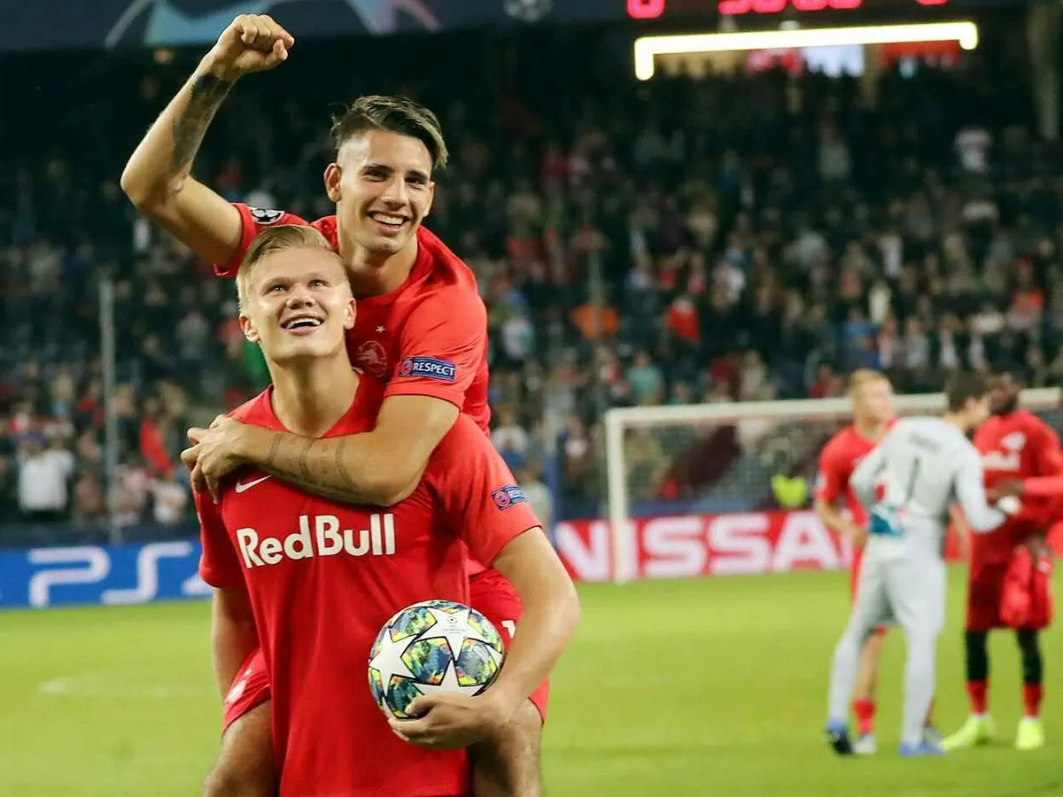 Salzburg's Hungarian midfielder Dominik Szoboszlai and Salzburg's Norwegian forward Erling Braut Haland react after the UEFA Champions League Group E football match Salzburg v Genk in Salzburg, Austria, on September 17, 2019. (Photo by KRUGFOTO / APA / AFP) / Austria OUT