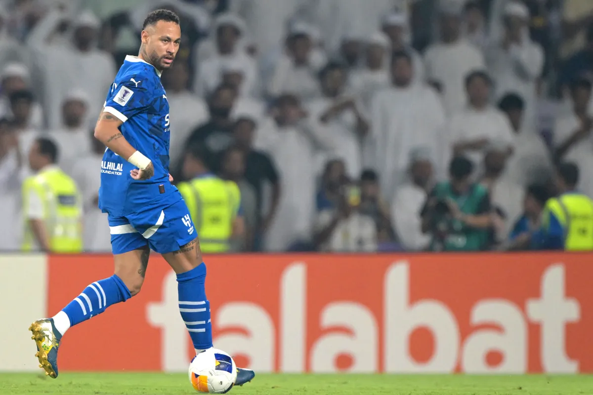 Hilal's Brazilian forward #10 Neymar runs with the ball during the AFC Champions League group B football match between UAE's Al-Ain and Saudi's Al-Hilal at the Hazza bin Zayed Stadium in al-Ain on October 21, 2024. (Photo by AFP)