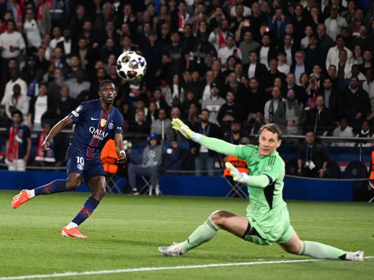 Ousmane Dembele (PSG) and Manuel Neuer (BAY) in action during the UEFA Champions League 2025/26 semi final first leg match between Paris Saint-Germain and Bayern Munich at the Parc des Princes Stadium in Paris, on April 28, 2026. Photo Jean-Marie Hervio / KMSP (Photo by HERVIO Jean-Marie / KMSP via AFP)