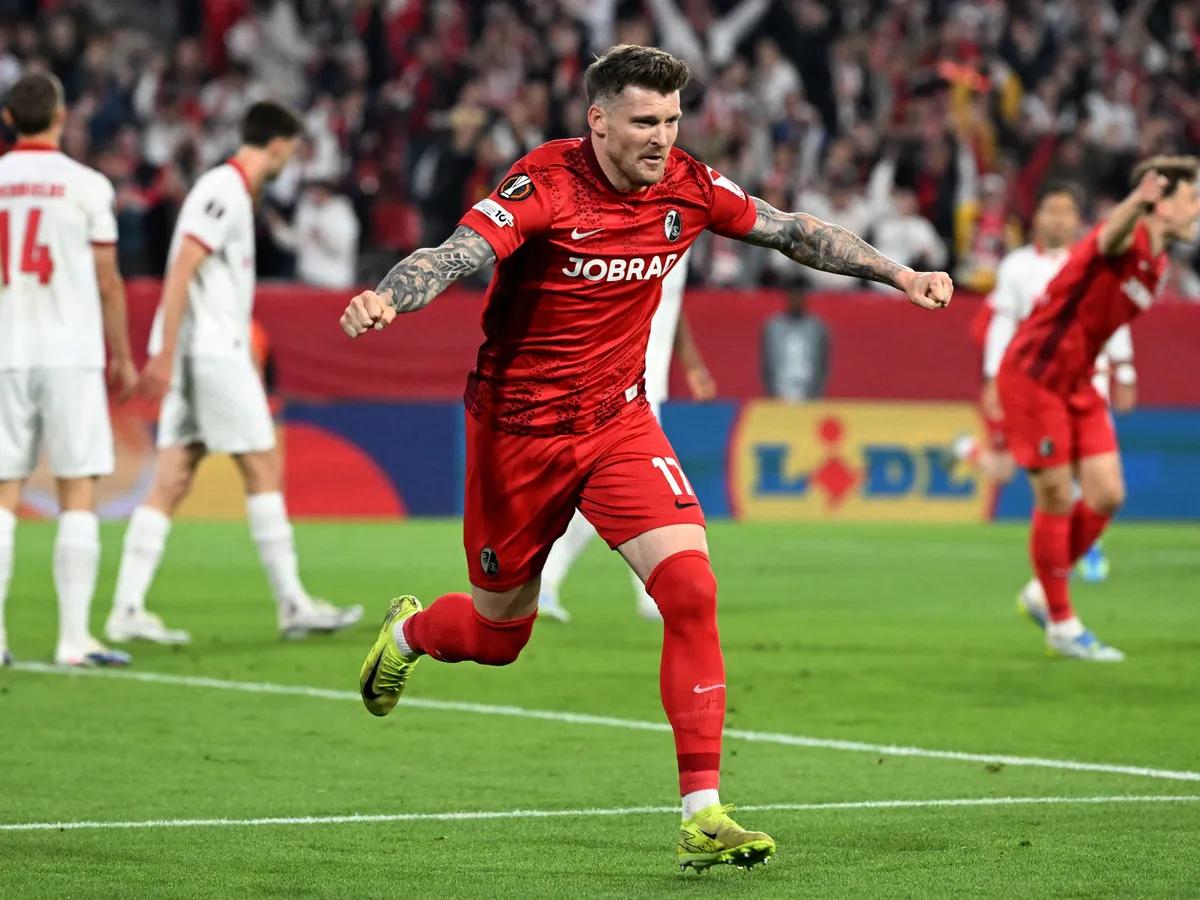 Freiburg's German defender #17 Lukas Kuebler celebrates scoring his team's first goal during the UEFA Europa League semi-final second leg football match between SC Freiburg and SC Braga in Freiburg im Breisgau, southwestern Germany on May 7, 2026. (Photo by THOMAS KIENZLE / AFP)