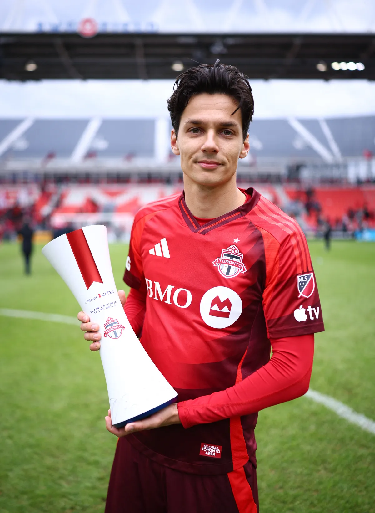 TORONTO, ON - MAY 02: Daniel Salloi #20 of Toronto FC receives the Michelob Ultra Superior Player Of The Match award after a game against the San Jose Earthquakes at BMO Field on May 02, 2026 in Toronto, Ontario, Canada.   Vaughn Ridley/Getty Images/AFP (Photo by Vaughn Ridley / GETTY IMAGES NORTH AMERICA / Getty Images via AFP)
