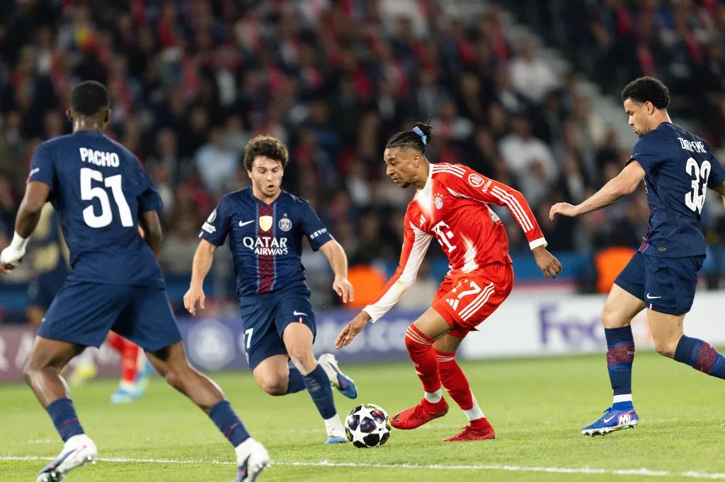 Joao Neves of Paris Saint-Germain (L), Micheal Olise of Bayern Munich (C), and Warren Zaire-Emery of Paris Saint-Germain (R) during the UEFA Champions League semi-final first leg football match between Paris Saint-Germain and Bayern Munich at the Parc des Princes. (Photo by Ibrahim Ezzat/NurPhoto) (Photo by Ibrahim Ezzat / NurPhoto via AFP)
