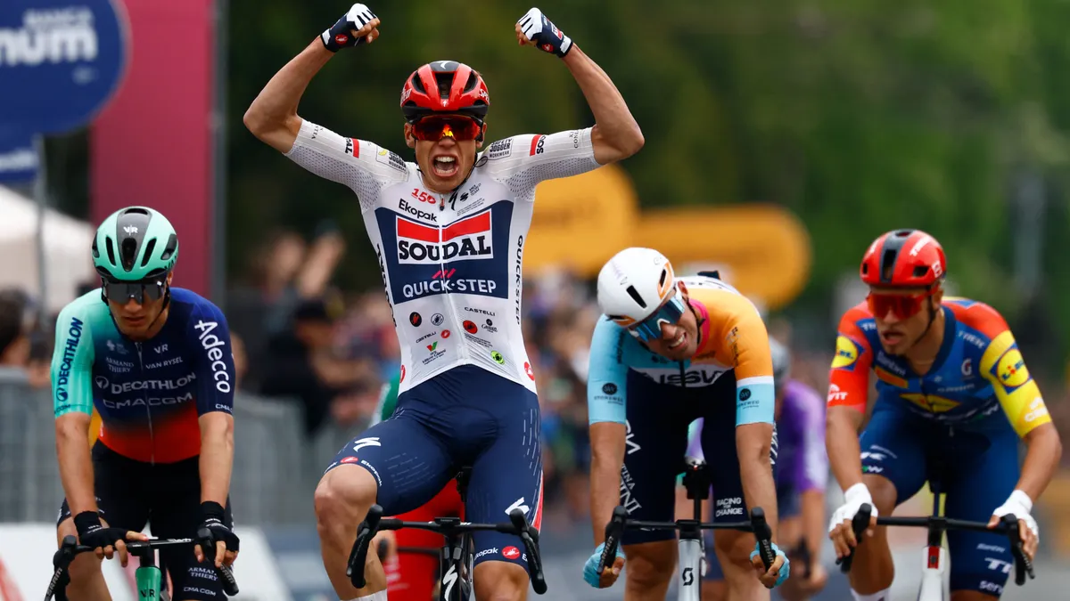Soudal Quick-Step French rider Paul Magnier celebrates as he crosses the finish line to win the 1st stage of the Giro d'Italia 2026 - Tour of Italy cycling race between Nessebar and Burgas, Bulgaria, on May 8, 2026. (Photo by Luca Bettini / AFP)