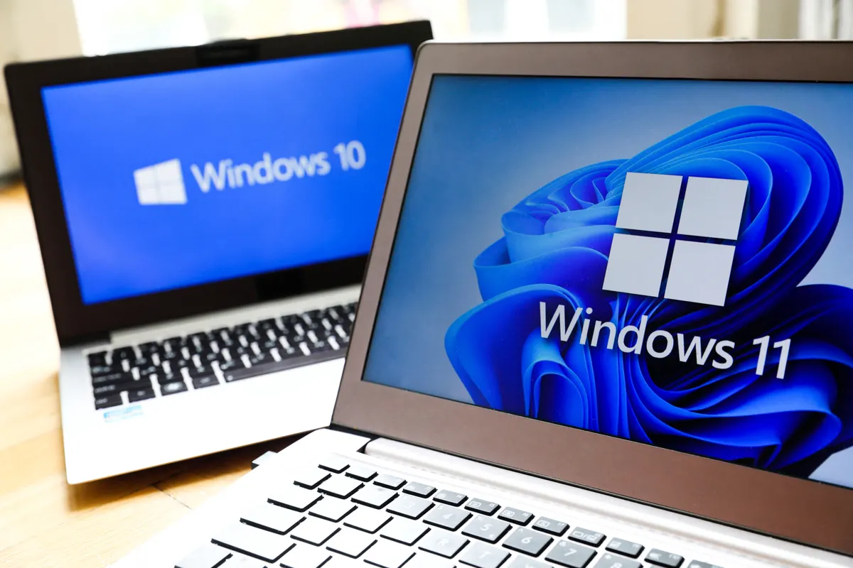 Windows 11 and Windows 10 operating system logos are displayed on laptop screens for illustration photo. Krakow, Poland on February 3, 2022. (Photo by Beata Zawrzel/NurPhoto) (Photo by Beata Zawrzel / NurPhoto via AFP)