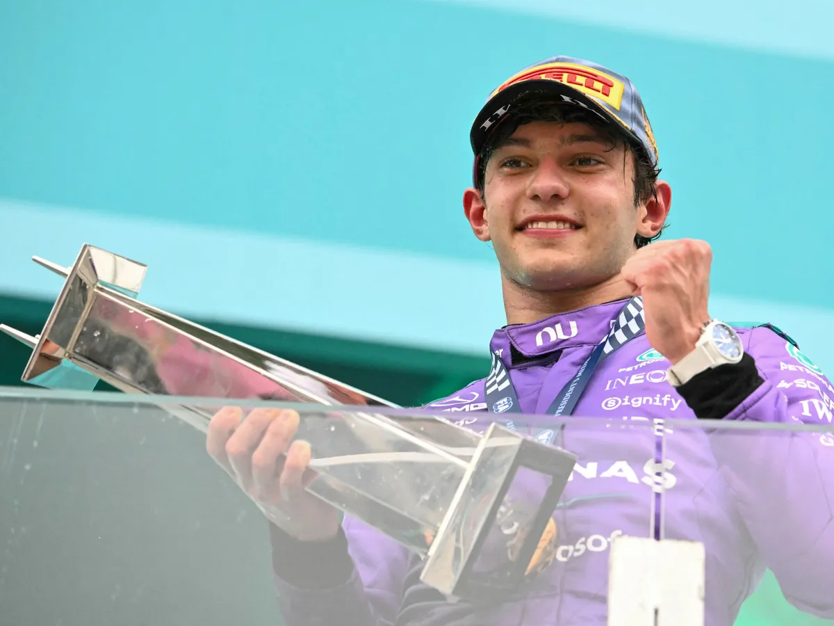 Race winner Mercedes' Italian driver Kimi Antonelli holds the trophy as he celebrates on the podium after the 2026 Miami Formula One Grand Prix at Miami International Autodrome in Miami Gardens, Florida, on May 3, 2026. (Photo by CHANDAN KHANNA / AFP)