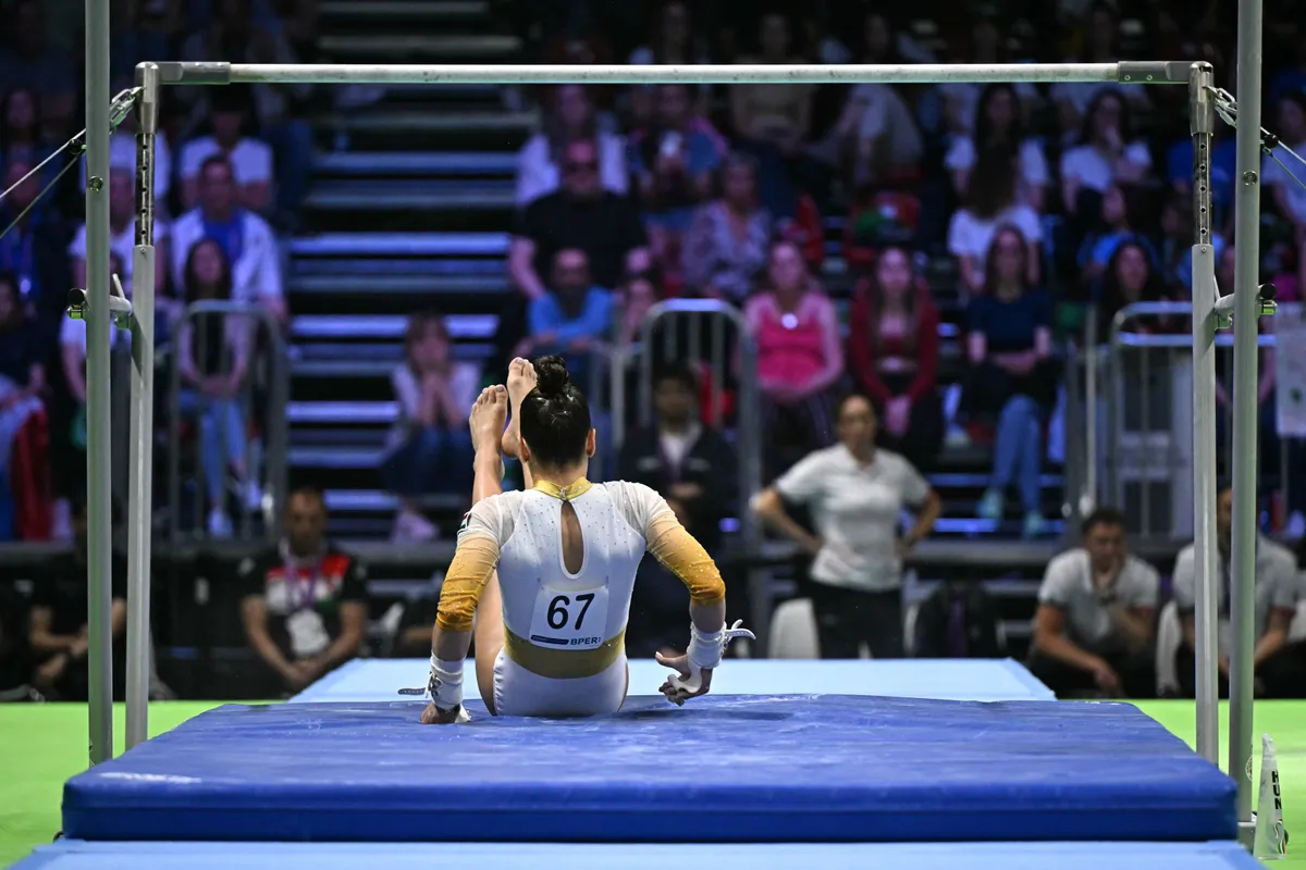 Hungary's Zoja Szekely falls as she competes on the Uneven Bars during the Seniors Women's Individual Apparatus Finals at the 35th Artistic Gymnastics European Women's Championships, in Rimini, on the Adriatic coast, northeastern Italy, on May 4, 2024. (Photo by GABRIEL BOUYS / AFP)