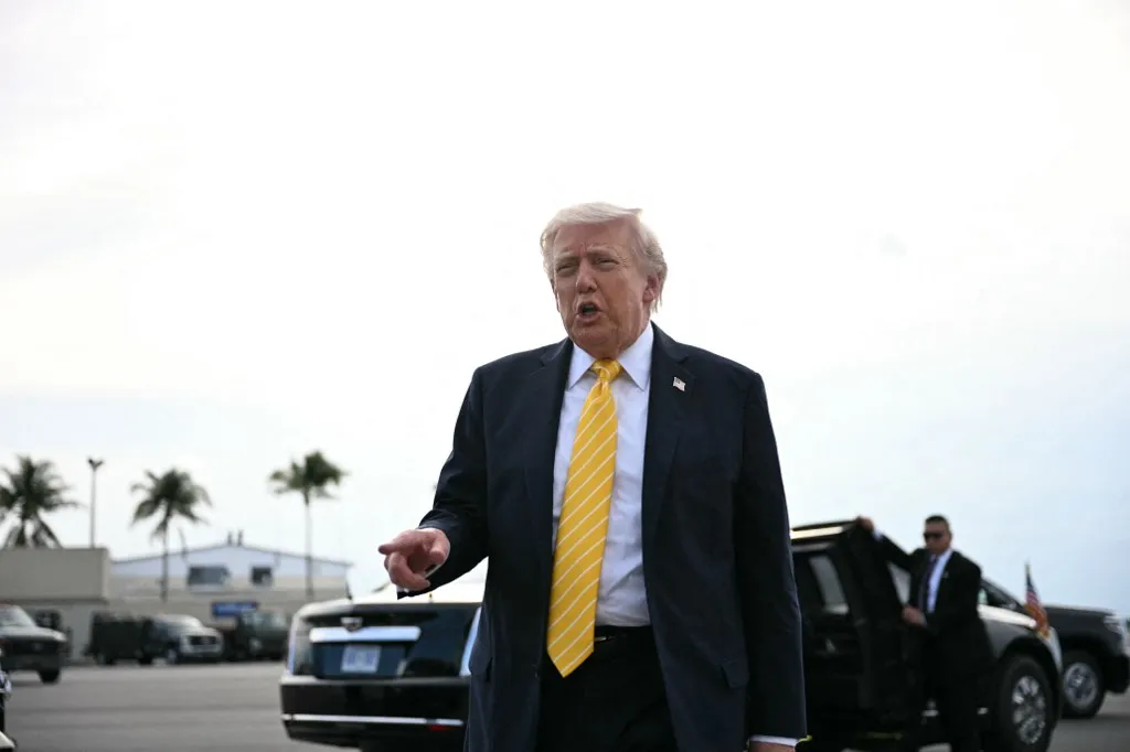 US President Donald Trump speaks with reporters at Palm Beach International Airport in West Palm Beach, Florida on May 2, 2026, before boarding Air Force One en route to Miami. (Photo by Jim WATSON / AFP)