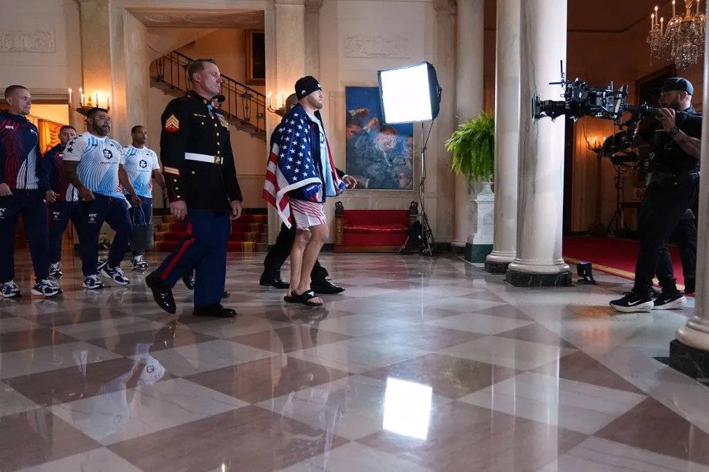 WASHINGTON, DC - JUNE 14: Justin Gaethje walks through the Grand Foyer of the White House before his lightweight title bout against Ilia Topuria (not pictured) at the UFC Freedom 250 fights taking place on the South Lawn on June 14, 2026 in Washington, DC. President Donald Trump is hosting a series of Ulitmate Fight Championship matches on his 80th birthday, which the White House is calling "a once-in-a-generation celebration of the American fighting spirit.   Jacquelyn Martin- Pool/Getty Images/AFP (Photo by POOL / GETTY IMAGES NORTH AMERICA / Getty Images via AFP)