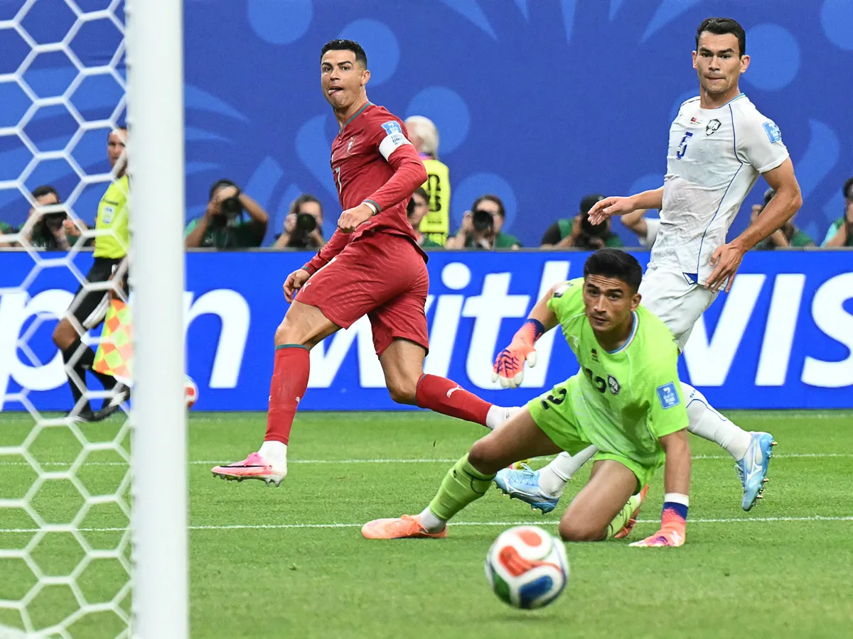 Portugal's forward #07 Cristiano Ronaldo (L) reacts as he scores his team's third goal during the 2026 World Cup Group K football match between Portugal and Uzbekistan at the Houston Stadium in Houston on June 23, 2026. (Photo by RONALDO SCHEMIDT / AFP)