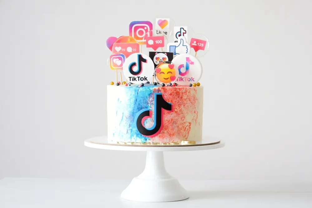 KAZAN, RUSSIA - April, 10, 2022: Cake with decorated with gingerbread cookies with a TikTok logo.